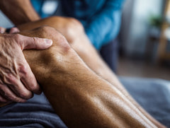 Man holding knee